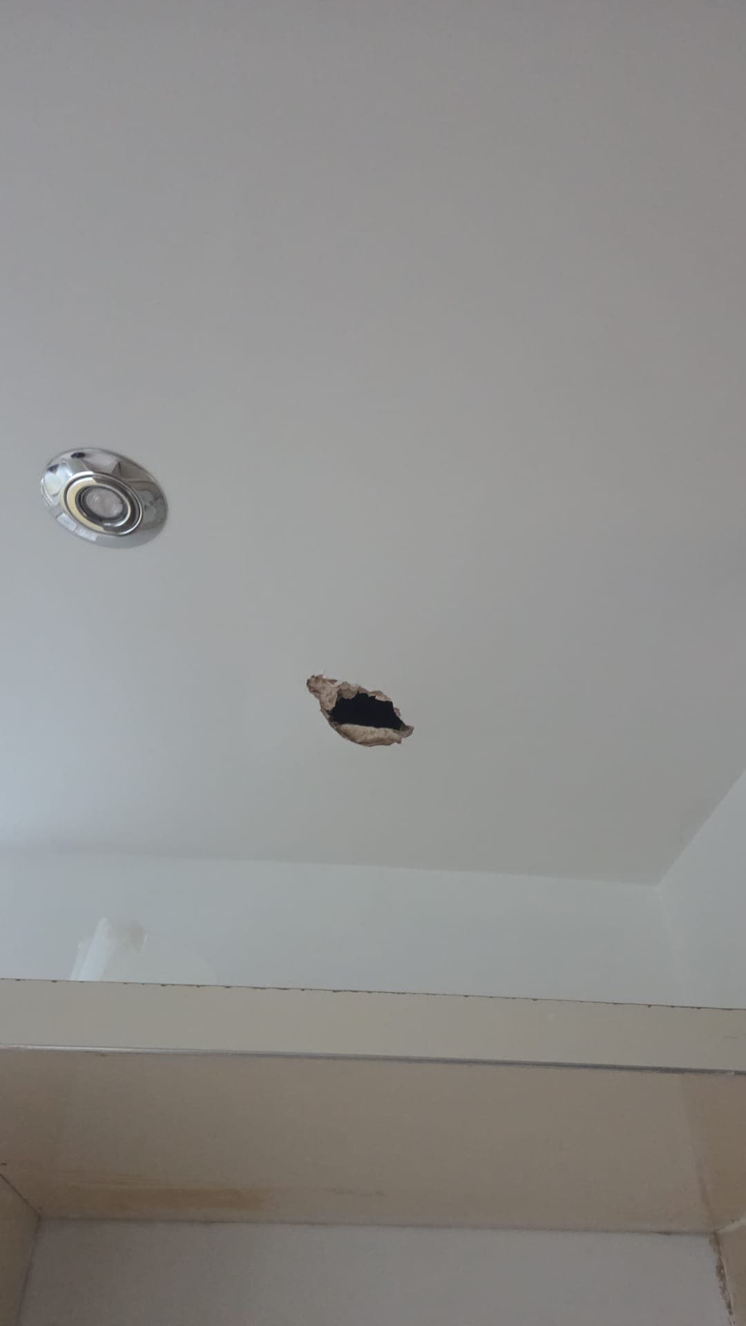 Emergency ceiling hole repair before - South London