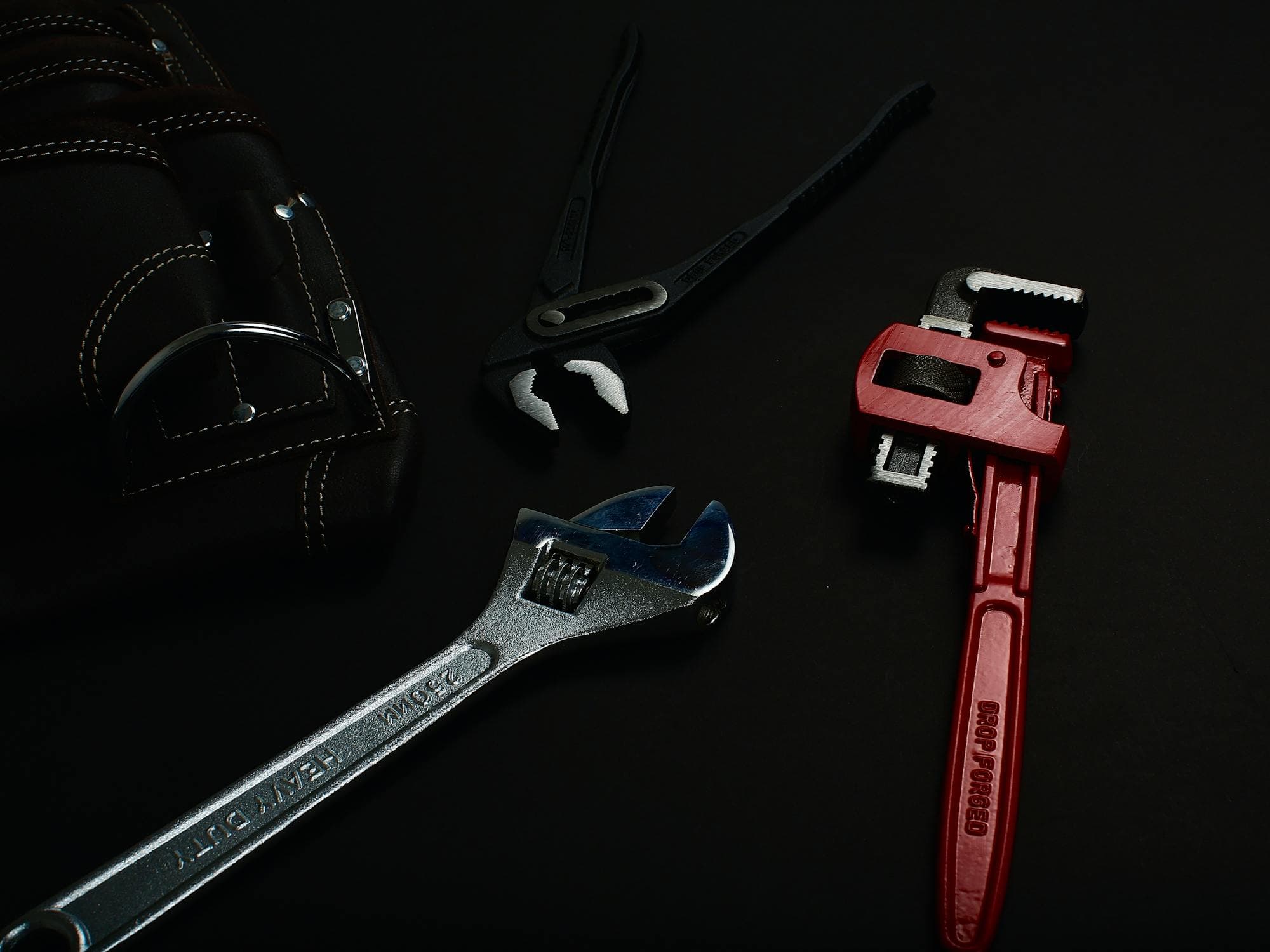 Close-up of professional plumbing and electrical repair tools