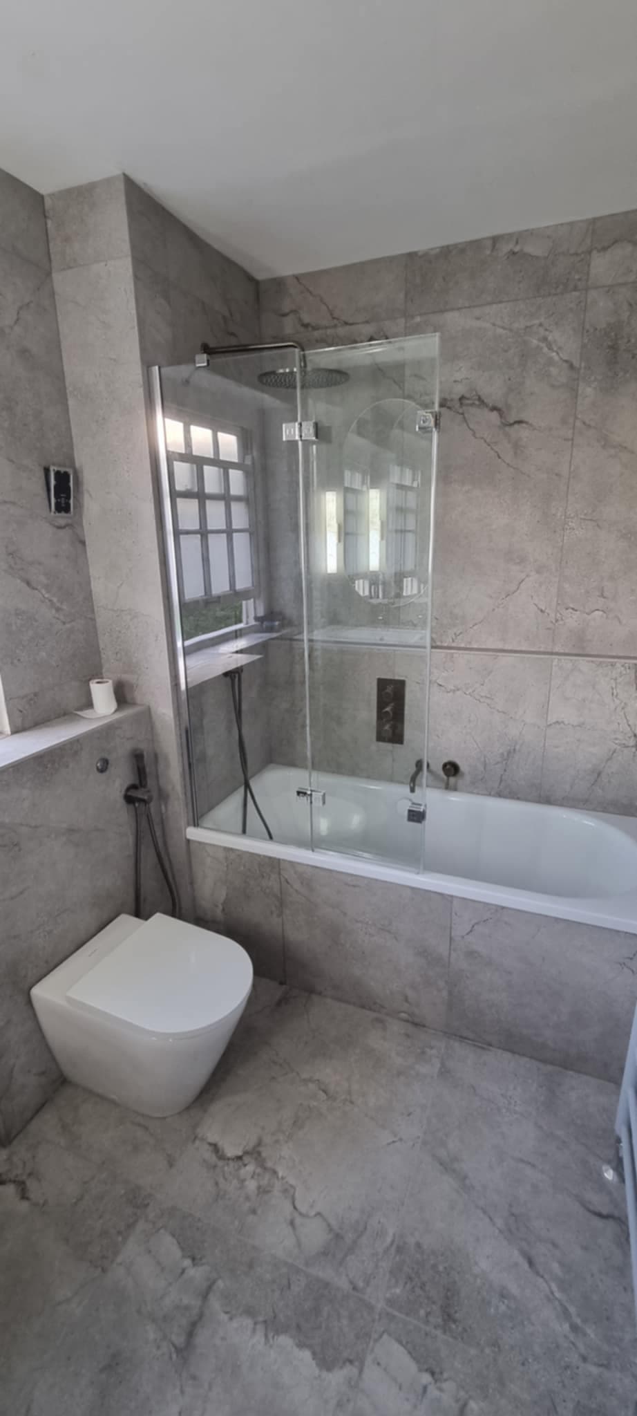 Grey marble bathroom with glass shower screen renovation