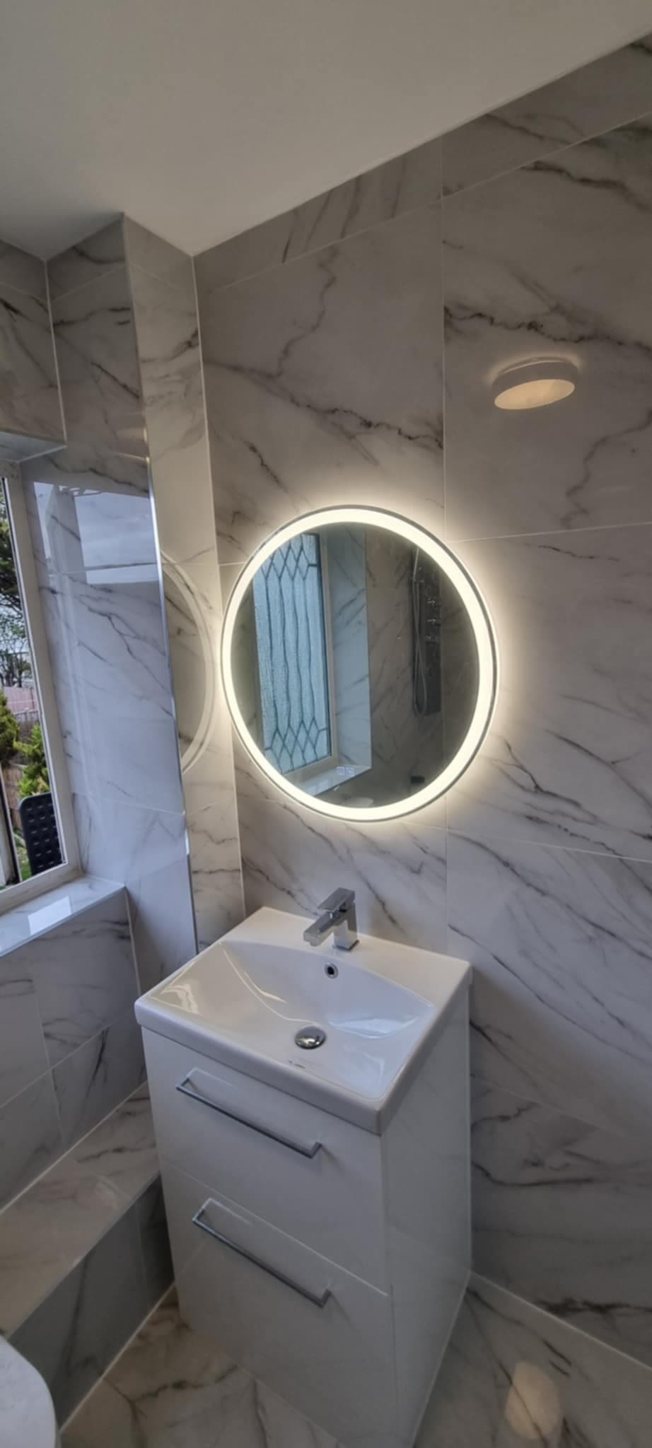 Marble bathroom with LED mirror vanity