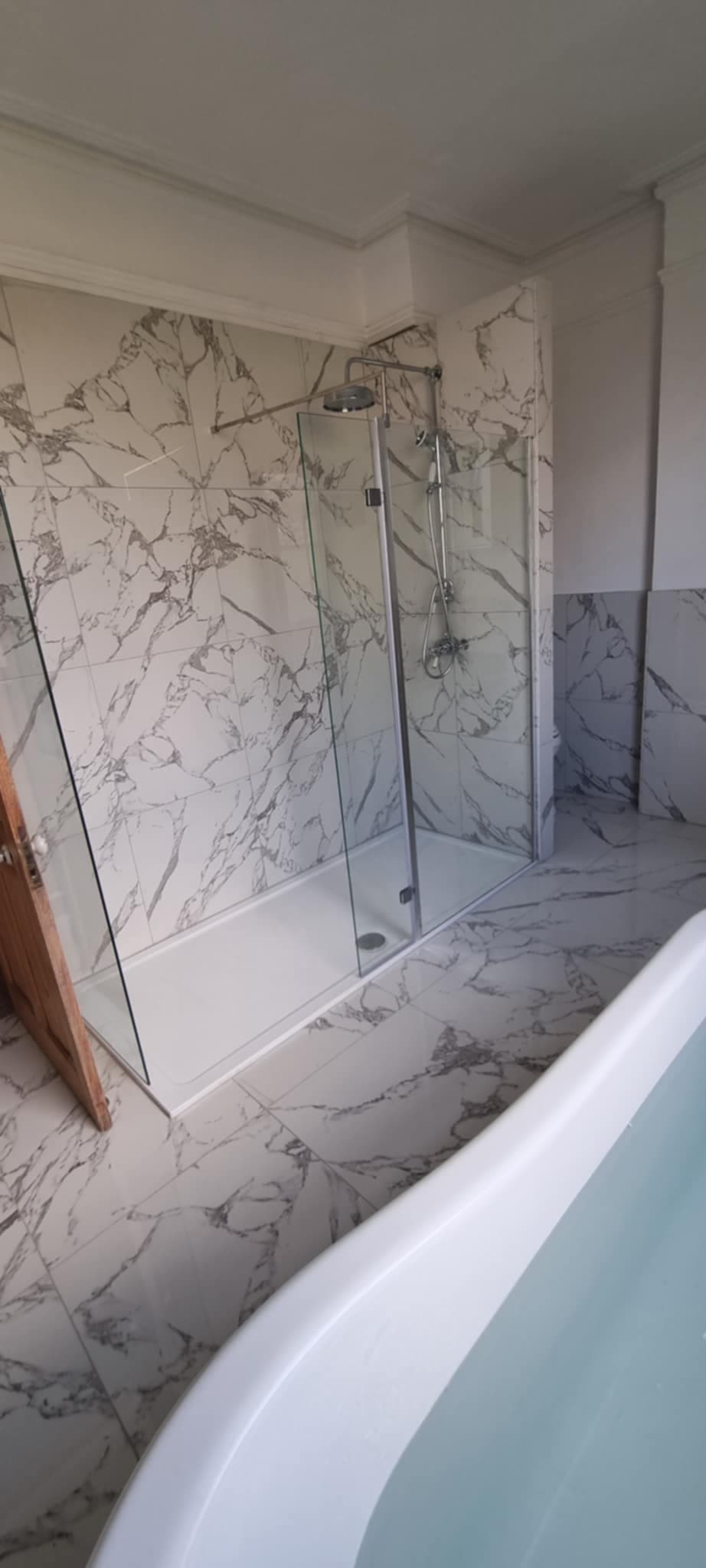 Marble walk-in shower and freestanding bath renovation