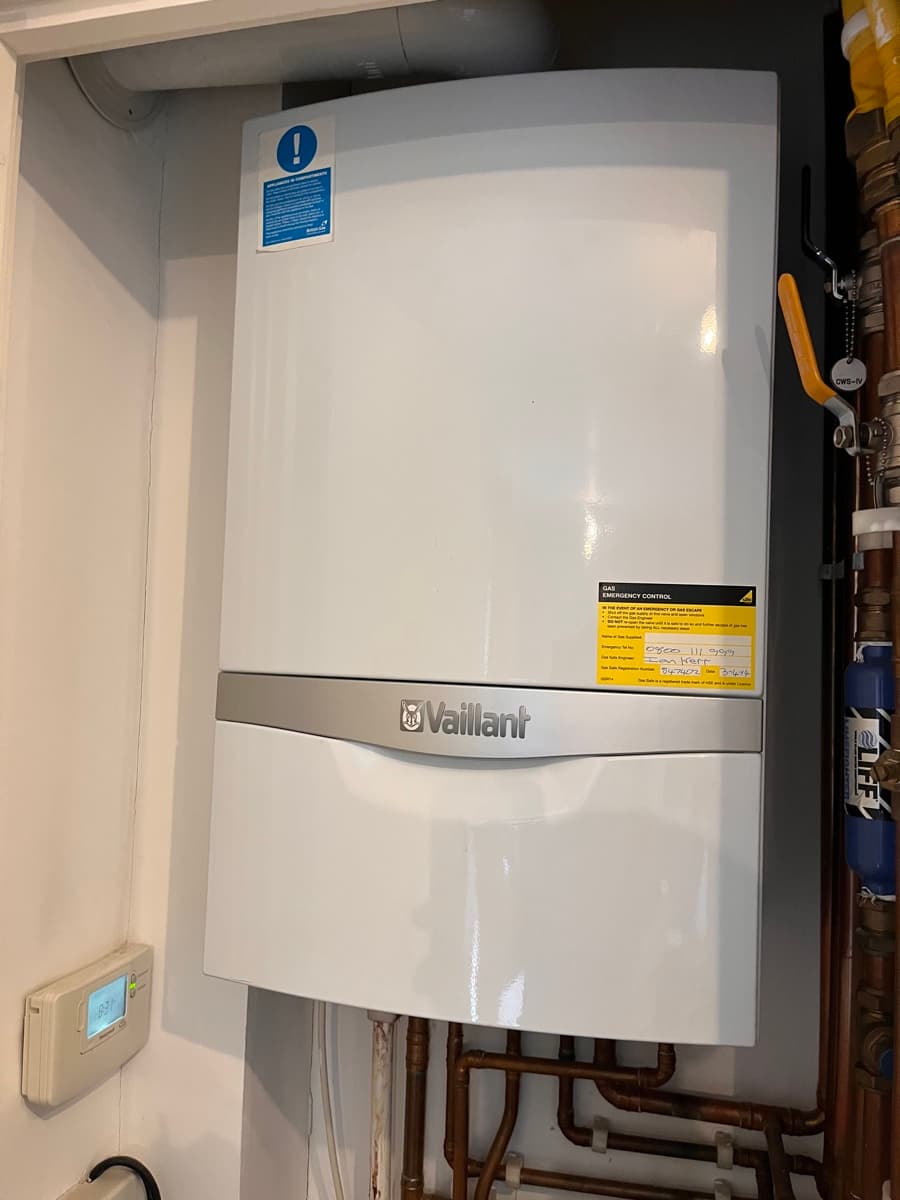 Vaillant boiler installation in cupboard with pipework