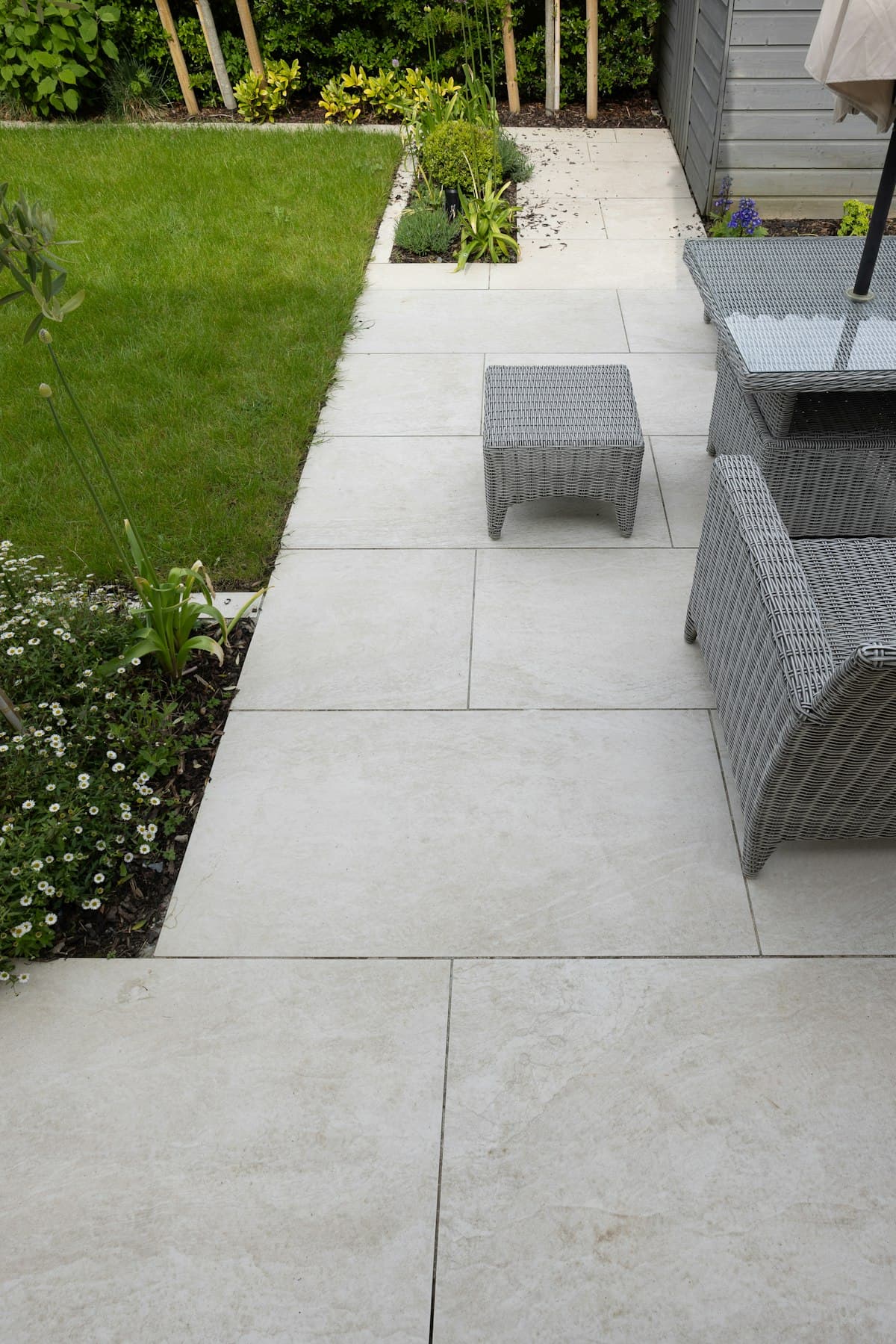 Landscaped garden with patio paving and lawn